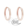 Rose Gold Huggie Earrings.